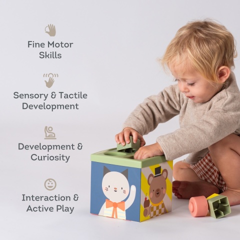 Taf Toys Pojemnik Zabawa i Odkrywanie – sensoryczna kostka edukacyjna 12m+ z chustkami, piłkami i klockami Taf Toys Pojemnik Zabawa i Odkrywanie – sensoryczna kostka edukacyjna 12m+ z chustkami, piłkami i klockami